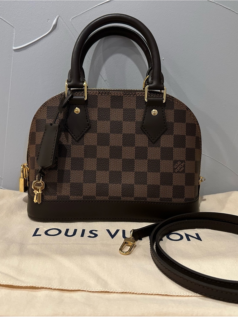 AUTHENTIC Louis Vuitton Damier Ebene Alma BB Satchel in Brown and Dark Brown